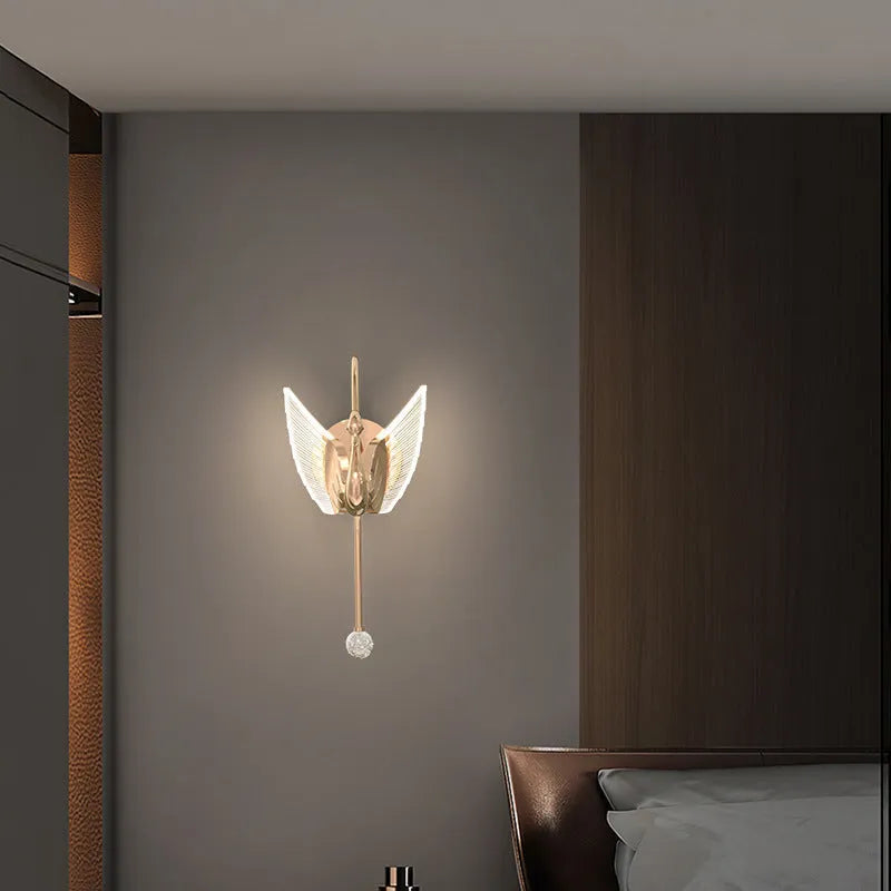 Gold modern swan-shaped wall lamp with an acrylic shade and dimmable LED light.