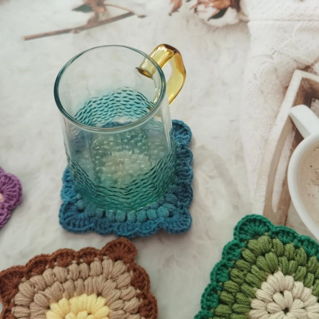 Crocheted wool insulated cup placemat with grandmother lattice pattern in colour choice