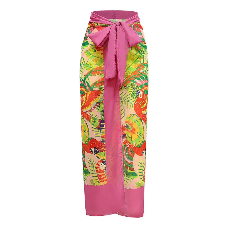 Retro pink floral print one-piece swimsuit with V-neck, skirt, and backless design.
