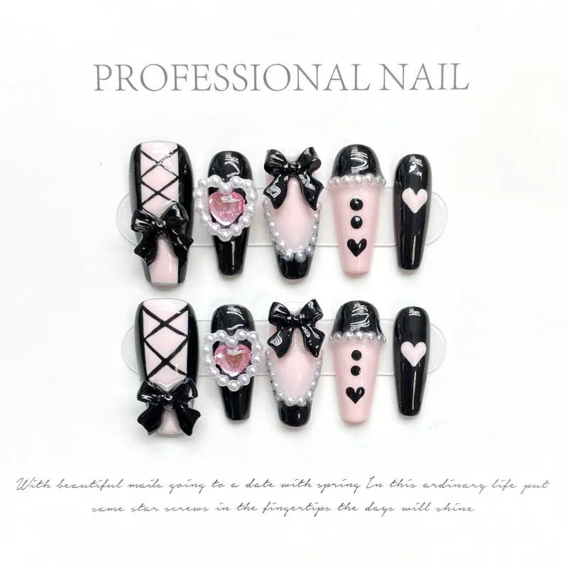 Hand-painted black pink heart design plastic nail armour set in four sizes