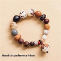 Handmade brown bodhi seed beads bracelet with 18 beads, shown on a wrist.