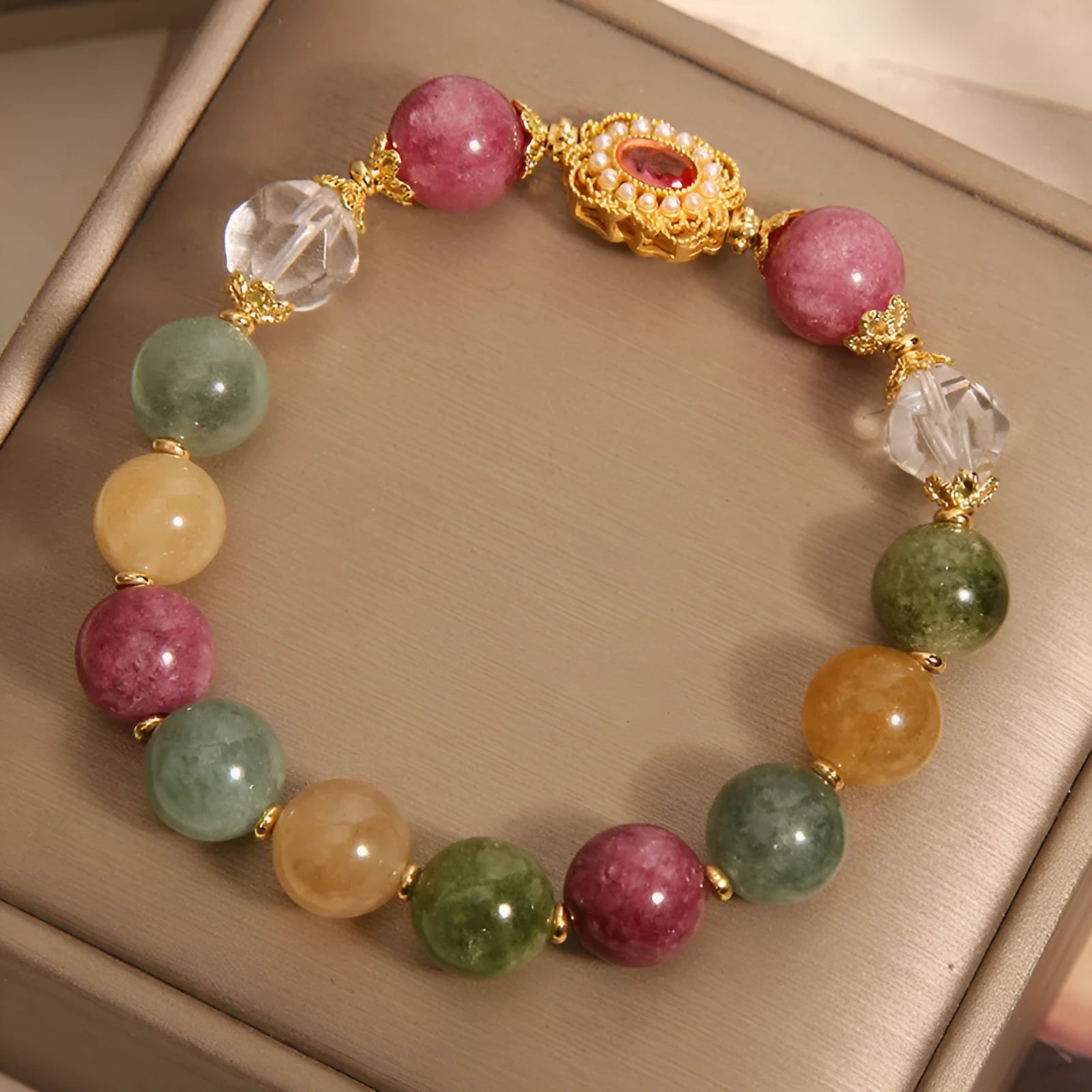 Women's alloy bracelet with colour tourmaline round beads on a pearl crystal base and rhinestone details.