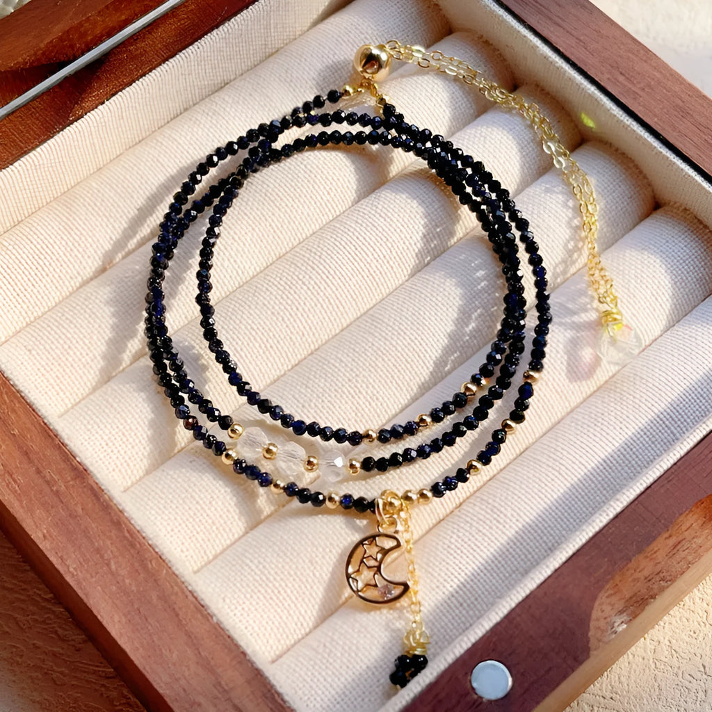 Blue gold three-ring women's bracelet with blue sand stone gemstone on adjustable fastening