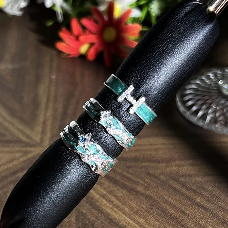 Mint green enamel asterism ring with copper construction and eight-awm star design