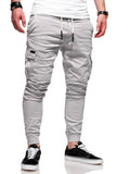 Men's light blue polyester baggy trousers with patch pockets and elastic waistband for casual leisure wear