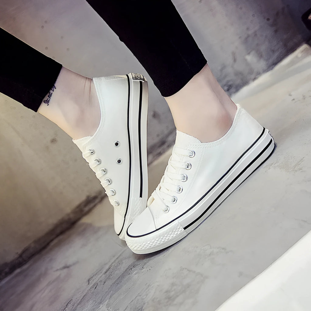Women's solid colour canvas casual shoes in black, white black, white red, and all black colourways
