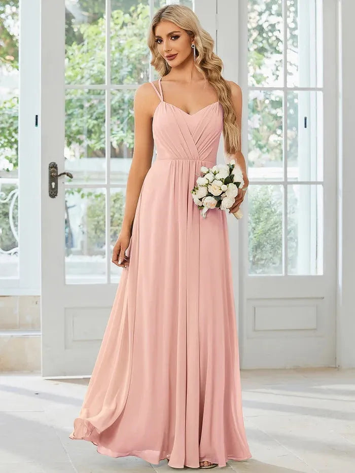 Women's sleeveless long dress with pleated detail and an A-line skirt in a light green colour.