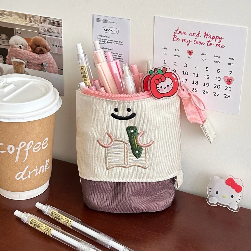 Brown and green Korean-style collapsible Oxford fabric pencil case showing 17cm by 14cm size.