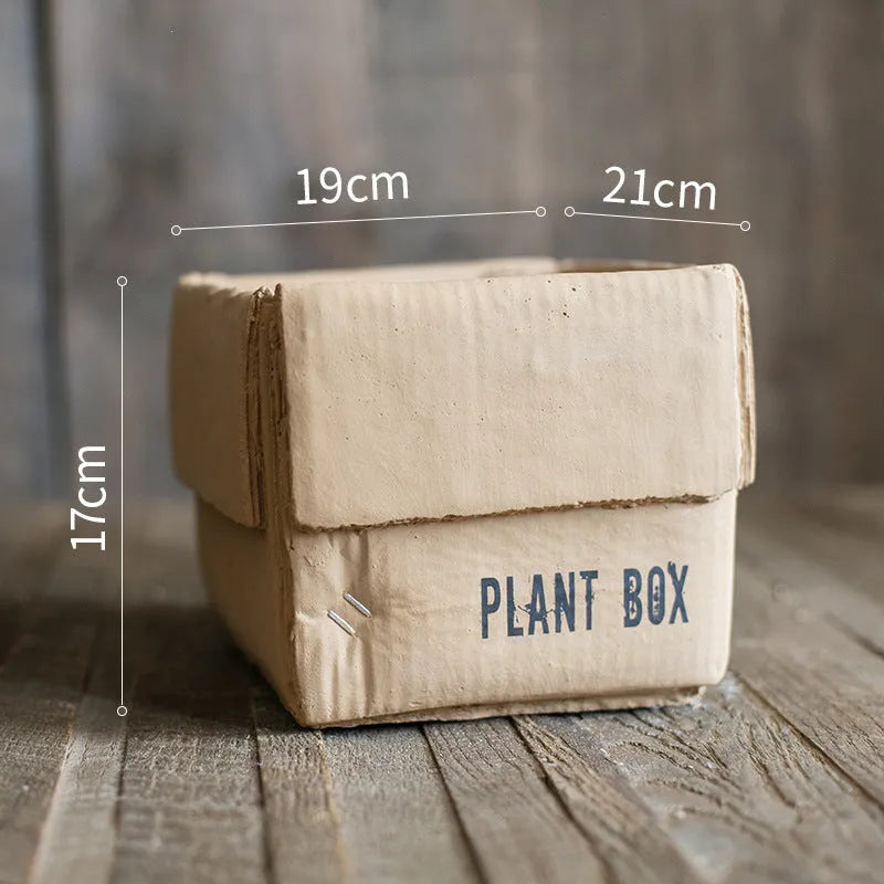 Cement flowerpot with brown paper box finish and drainage holes in bottom