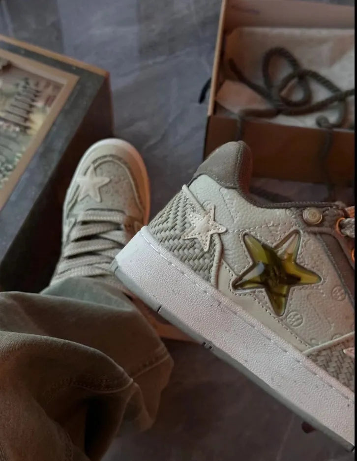 Green star-pattern low-top casual shoes with laces and a thick rubber sole.