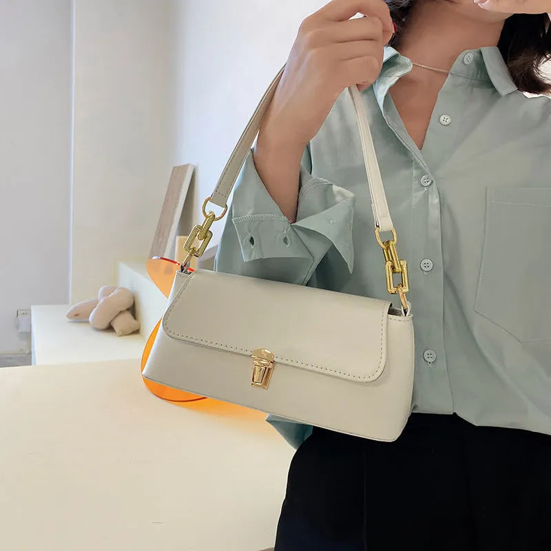 Brown French casual underarm bag with single shoulder chain strap and sandwich pocket design