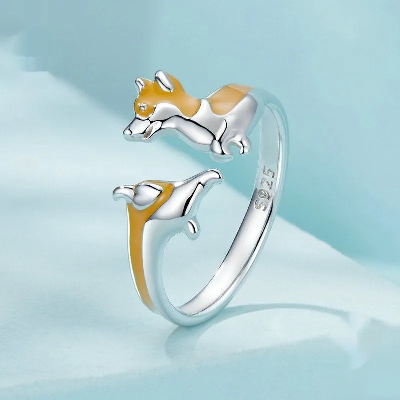 Silver ring with a raised cartoon corgi dog design, colour SCR1014-E.