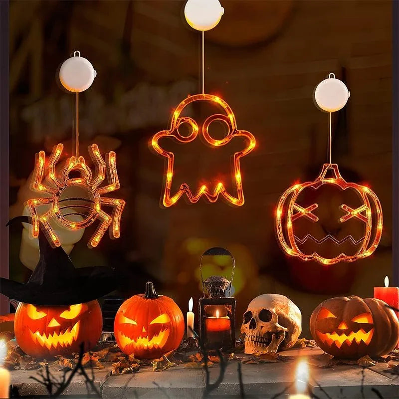 Halloween LED window lights with suction cups showing ghost, spider, and pumpkin decorations