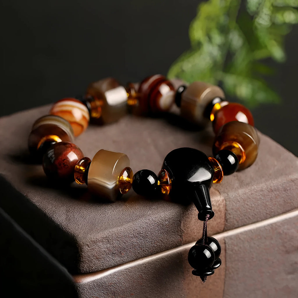 Old agate bracelet with A13 sardonyx bead, white agate spacers, and red agate barrel bead in geometric ethnic design