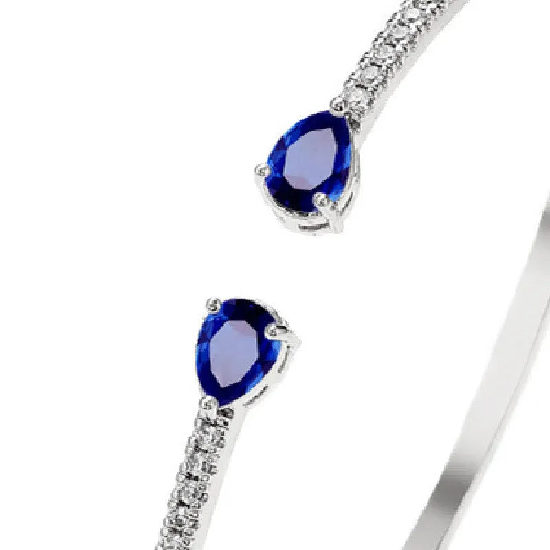 Multi-zircon fashion bracelet crafted from copper with zircon inlaid treatment in white or blue colour