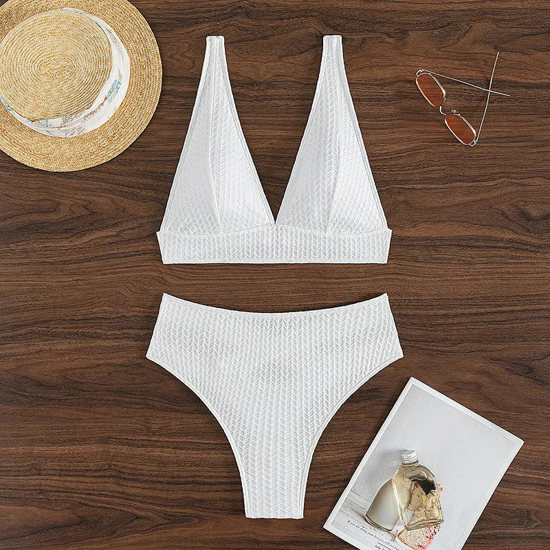 White backless women's bikini swimsuit with briefs style on mannequin