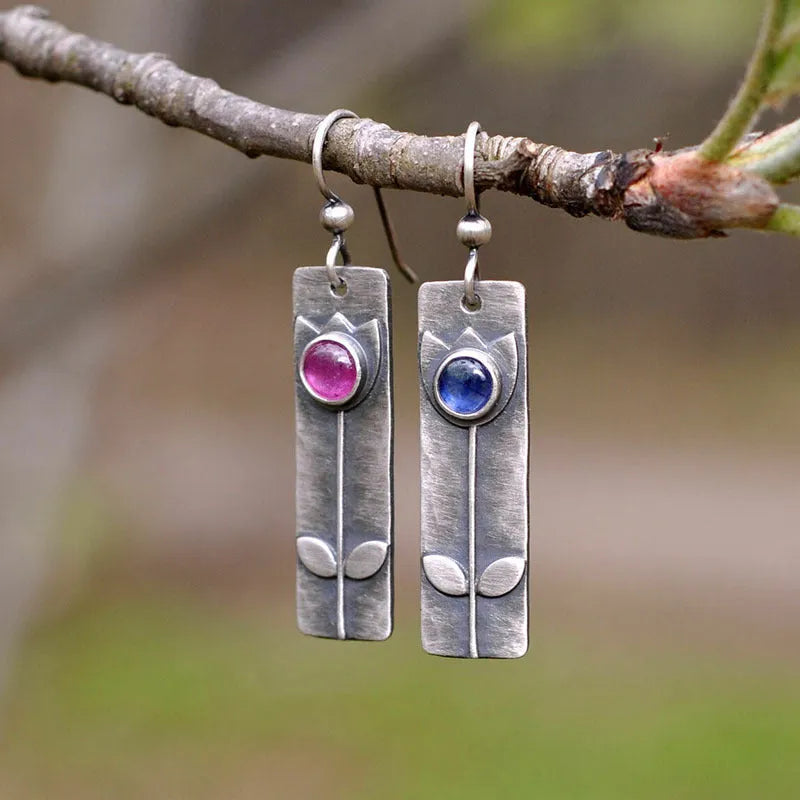 Antique finish red sapphire earrings with geometric ellipse design on electroplated metal