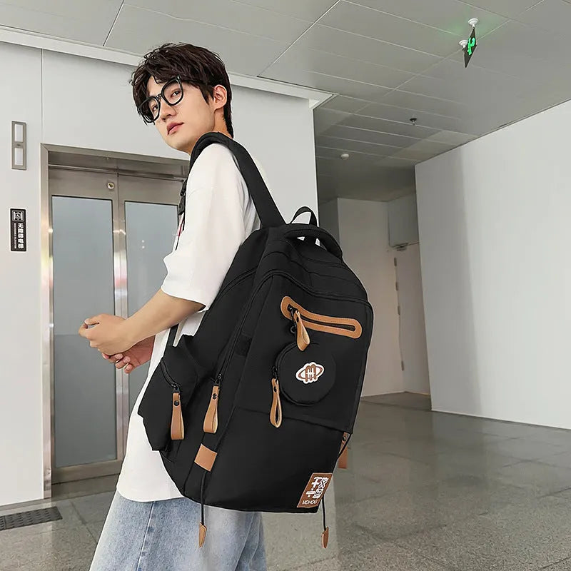 Japanese leisure travel backpack in black with contrast stitching and 20-35 litre capacity