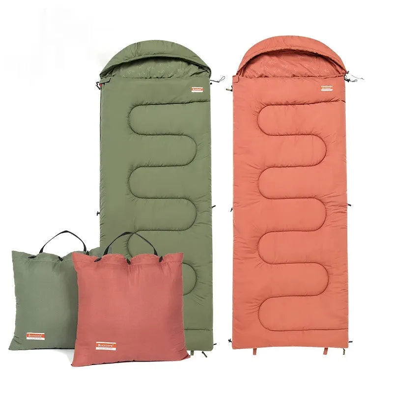 Ochre and olive green portable cotton camping sleeping bag quilt laid flat.