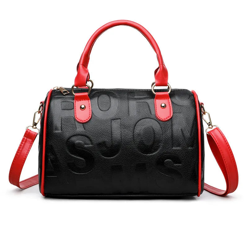 Brown cylindrical crossbody bag with leather-like texture and three shoulder straps