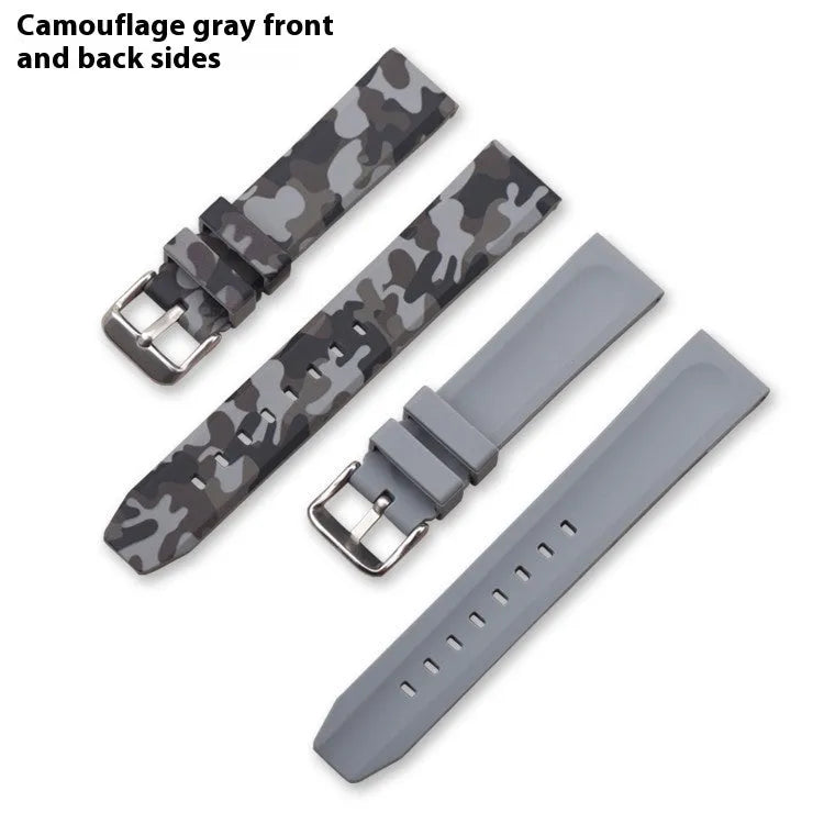 Green camouflage silicone watch strap shown detached, displaying its 20mm width and flat head lug design.