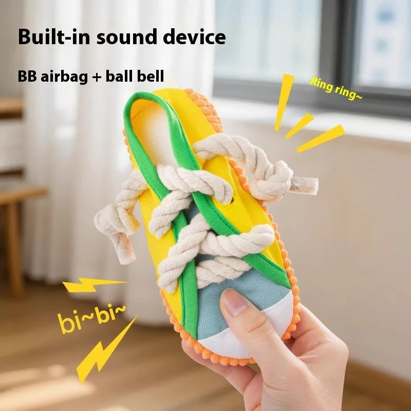 Plastic squeaky slipper-shaped dog chew toy in yellow, black, or blue.