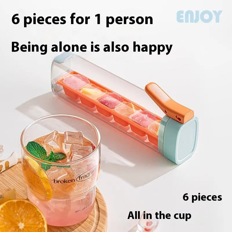 Food-grade ice cube mould with one-press release mechanism and storage box in kitchen setting