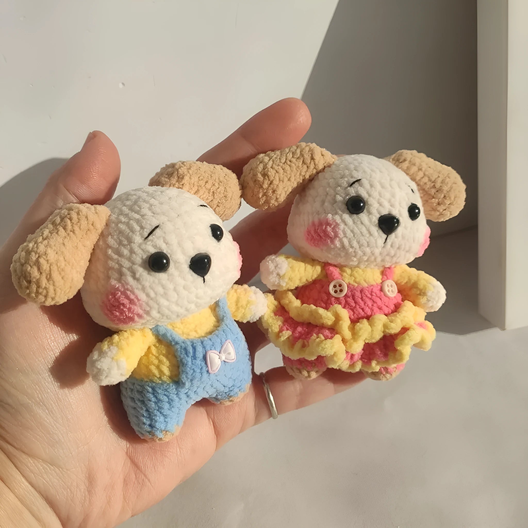 Handmade woollen zodiac dog pendant charm on a keychain, shown in pinafore dress style.
