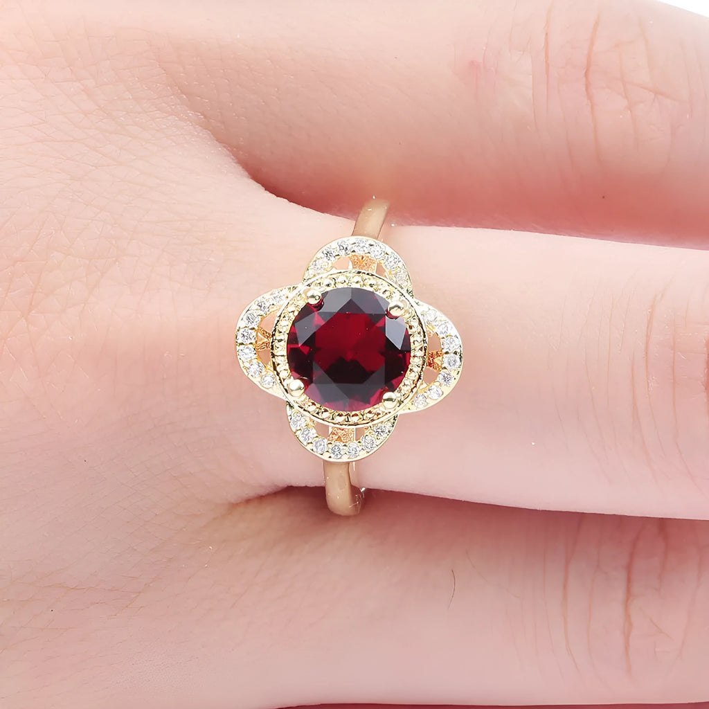 Close-up of a copper fruit-shaped ring with a central zircon stone in colour 10-6-1395.
