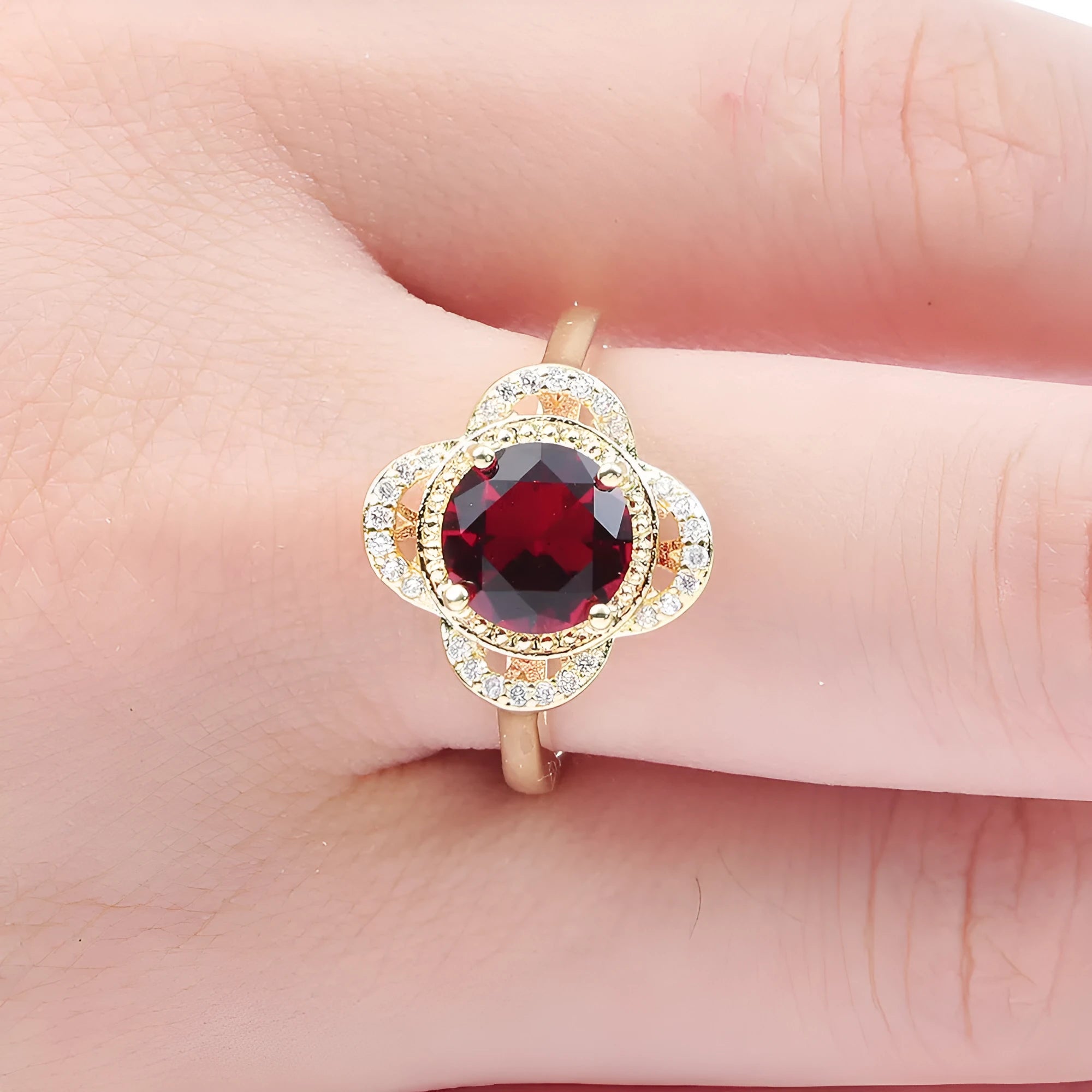 Close-up of a copper fruit-shaped ring with a central zircon stone in colour 10-6-1395.