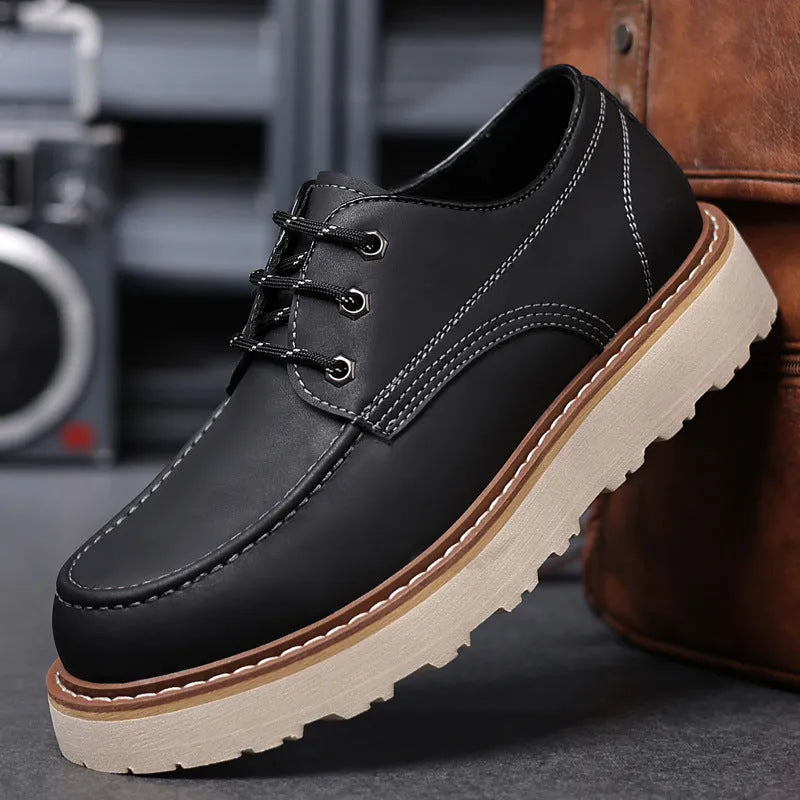 Men's black retro low-top casual boots with round toe and rubber sole on a neutral background.