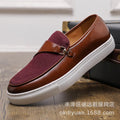 Men's black leather slip-on shoes with horsebit buckle and round toe design