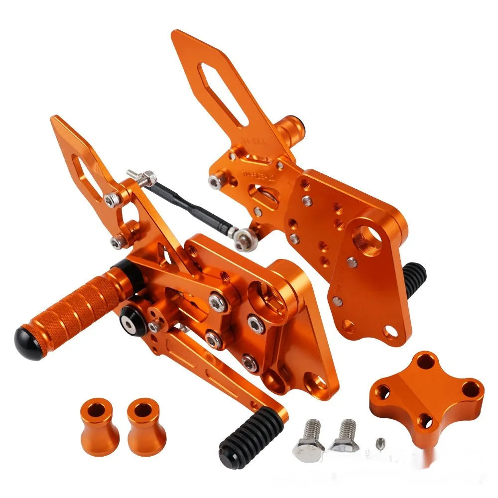 KTM Duke motorcycle raised footpeg support assembly in black and orange colours