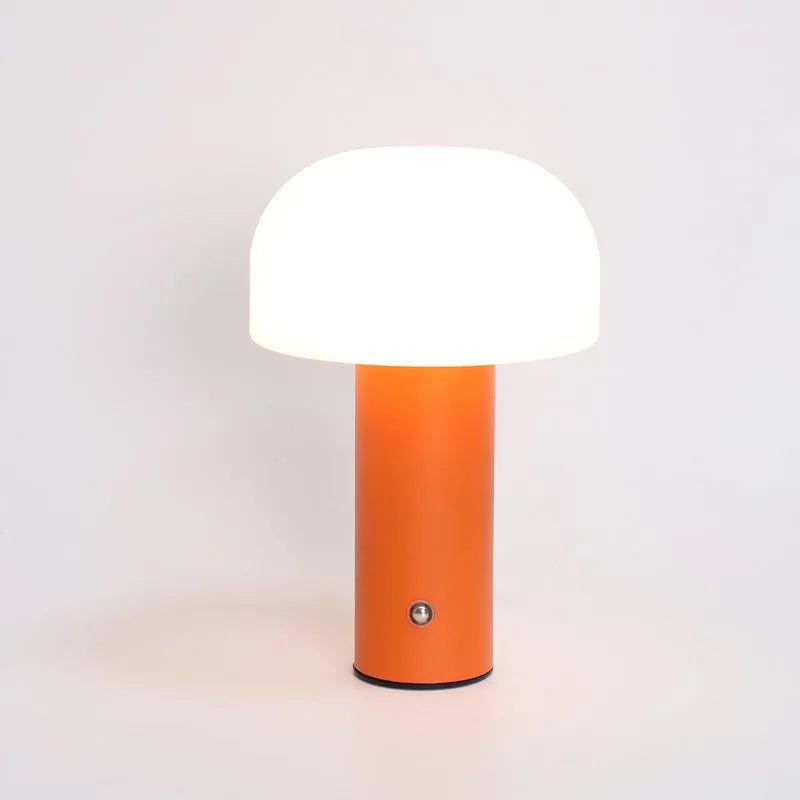 USB-powered plastic table lamp in black, white, orange, and green colour options.