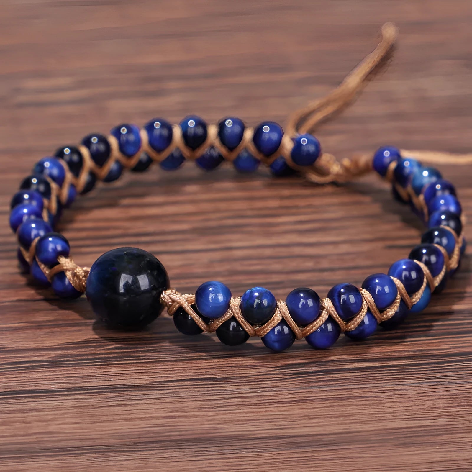Hand-woven geometric pull bracelet with tigereye stone beads in blue or amethyst colour