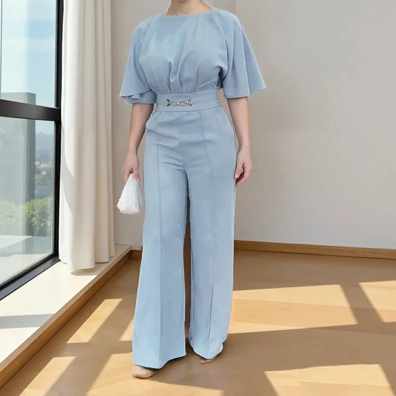Blue two-piece polyester men's suit with long-sleeve jacket and trousers on a hanger.