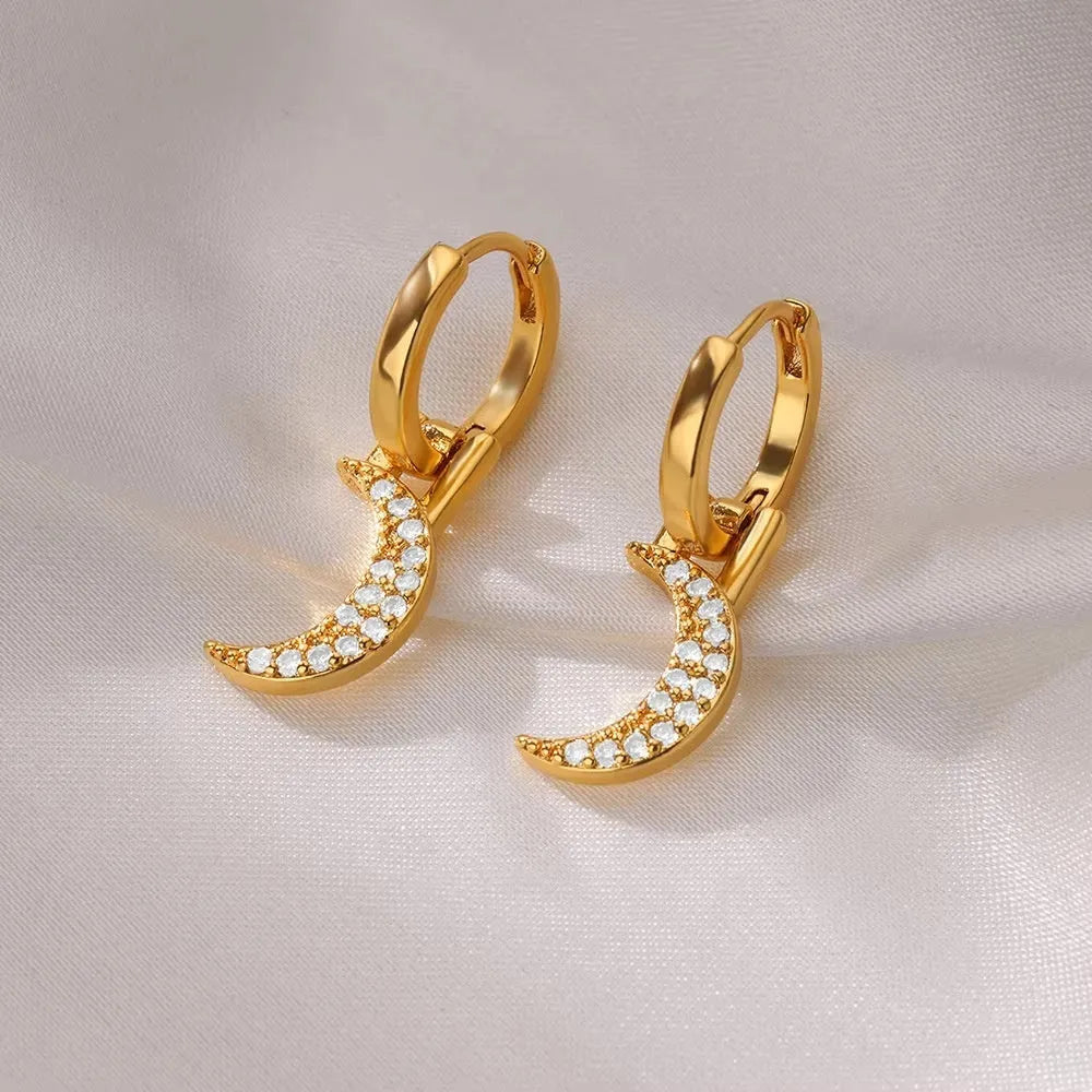 Women's copper geometric butterfly earrings with heart and star motifs in various colours.