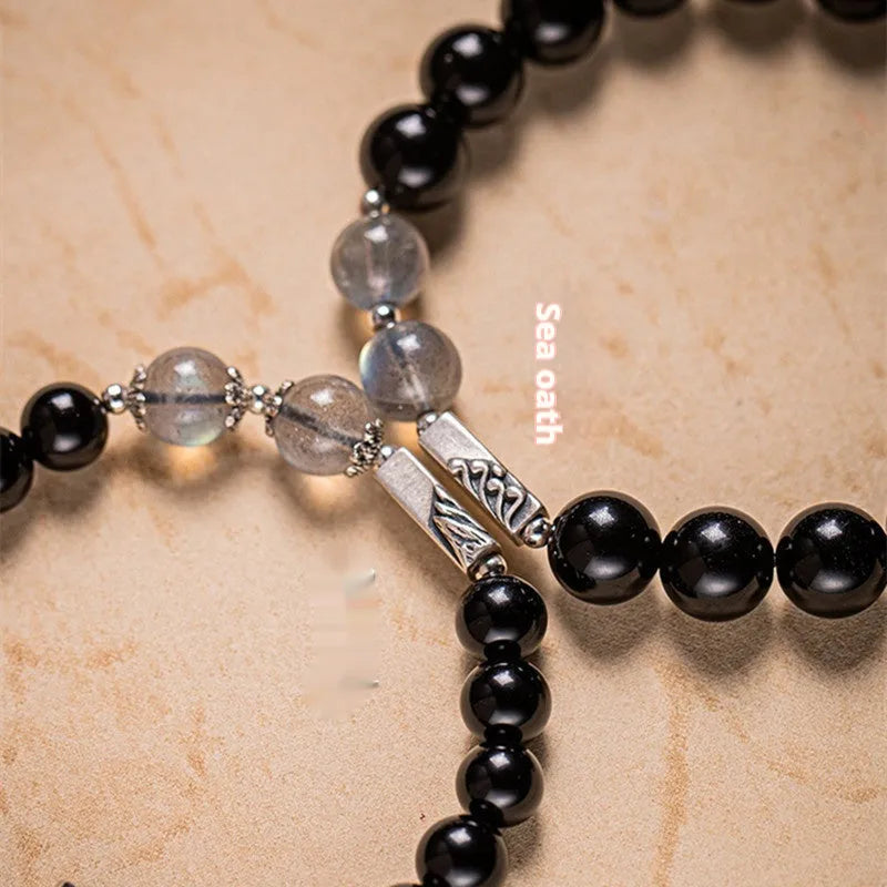DIY kit with black obsidian Buddha beads, 8mm and 10mm sizes, and cord for a couple's bracelet set.