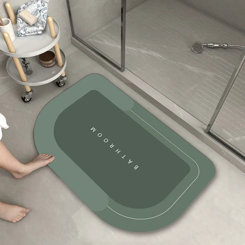 Diatom mud absorbent bathroom floor mat in blue rectangular shape on tiled floor