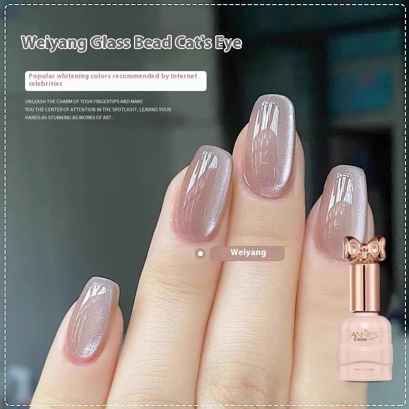 Micro glass bead cat's eye gel nail polish bottle showing cat's eye visual effect
