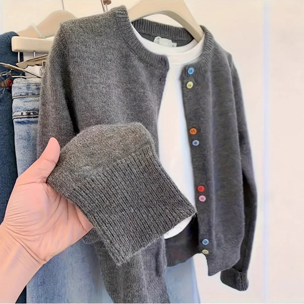Dark grey women's button-front cardigan sweater with long sleeves on a hanger