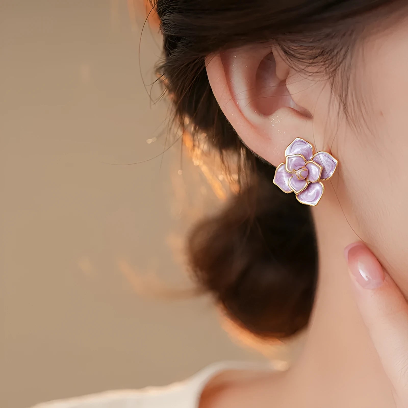 Gold plated copper flower stud earrings with purple oil-spot glaze finish and floral shape design