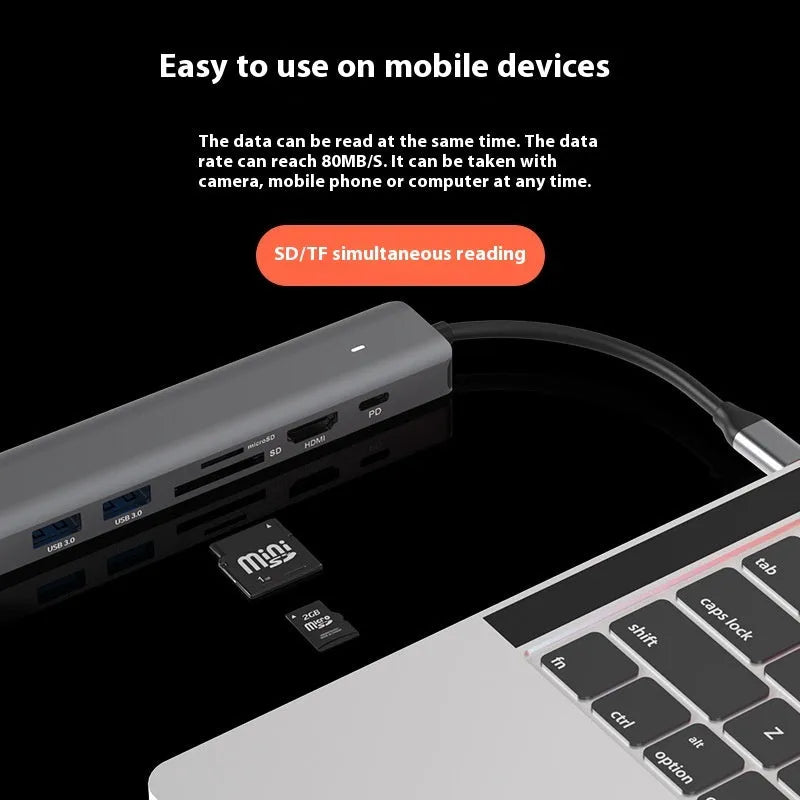 7-in-1 USB-C multi-port hub with SD card slot, microSD slot, three USB ports, and PD charging port.