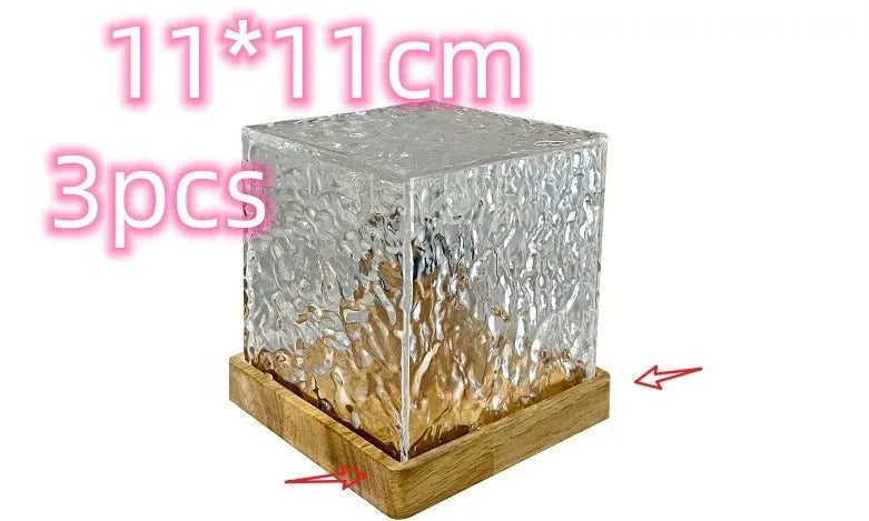 LED water ripple night light with rotating crystal projection and remote control on wooden surface