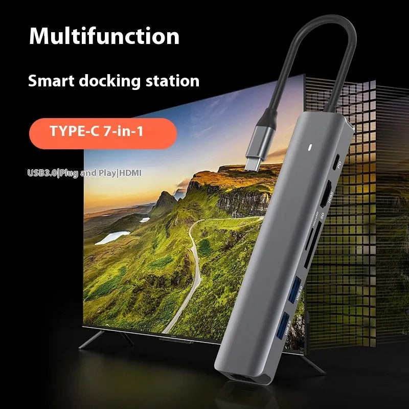 7-in-1 USB-C multi-port hub with SD card slot, microSD slot, three USB ports, and PD charging port.