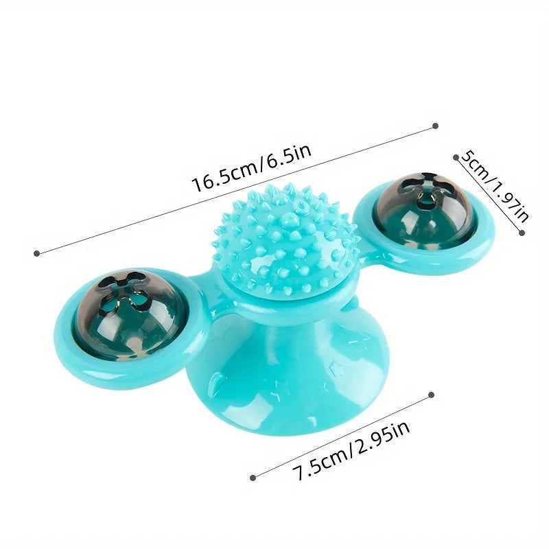 Rotating windmill cat toy with LED light and catnip balls on a white wall
