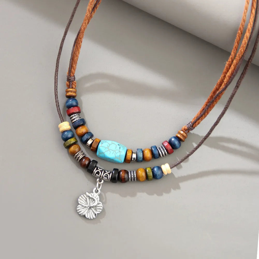 Men's retro wooden bead necklace with geometric alloy pendant and turquoise accents on wax rope cord.