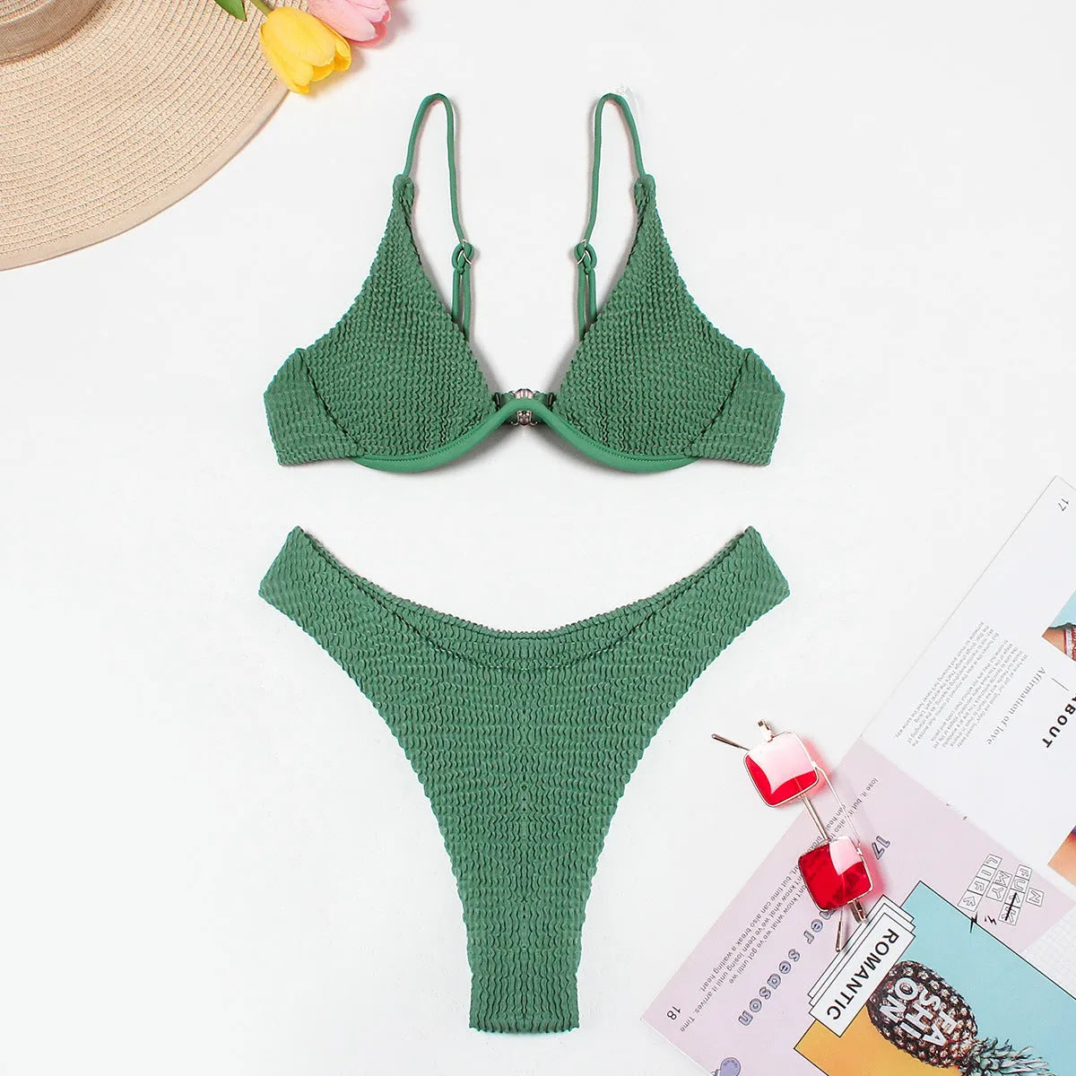 Green women's bikini set with ruffle trim, showing top and split briefs made from quick-dry polyester fabric.