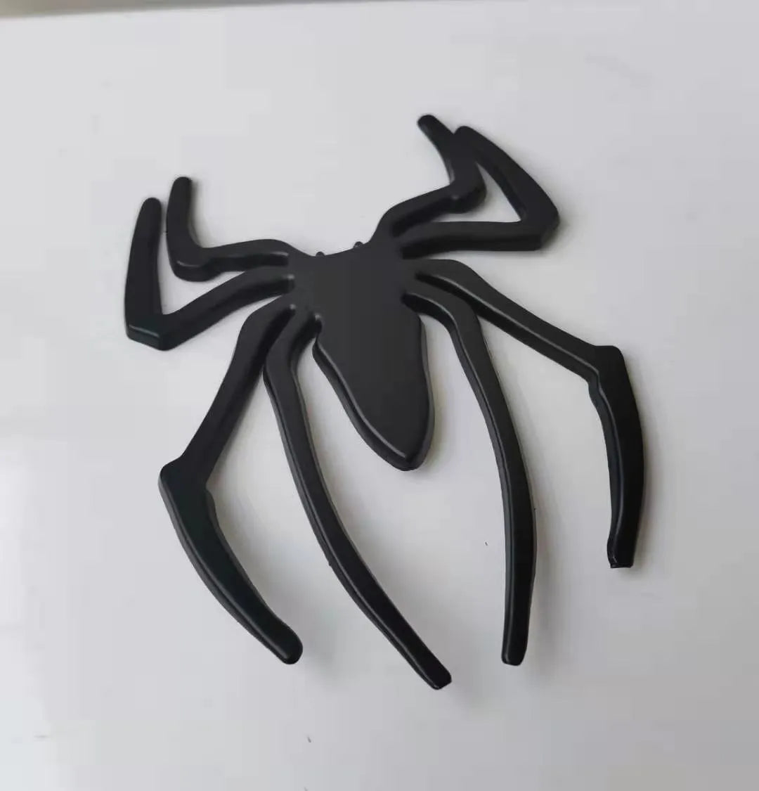 Zinc alloy 3D spider car bumper sticker in gold, silver, black, and red colours.