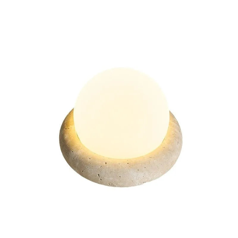 Cream coloured remote control bedside night light with circular 15.5cm diameter design